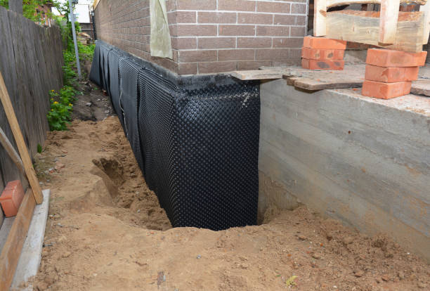 SJ Waterproofing Pros technician performing targeted Waterproofing assessment in Oshkosh, WI